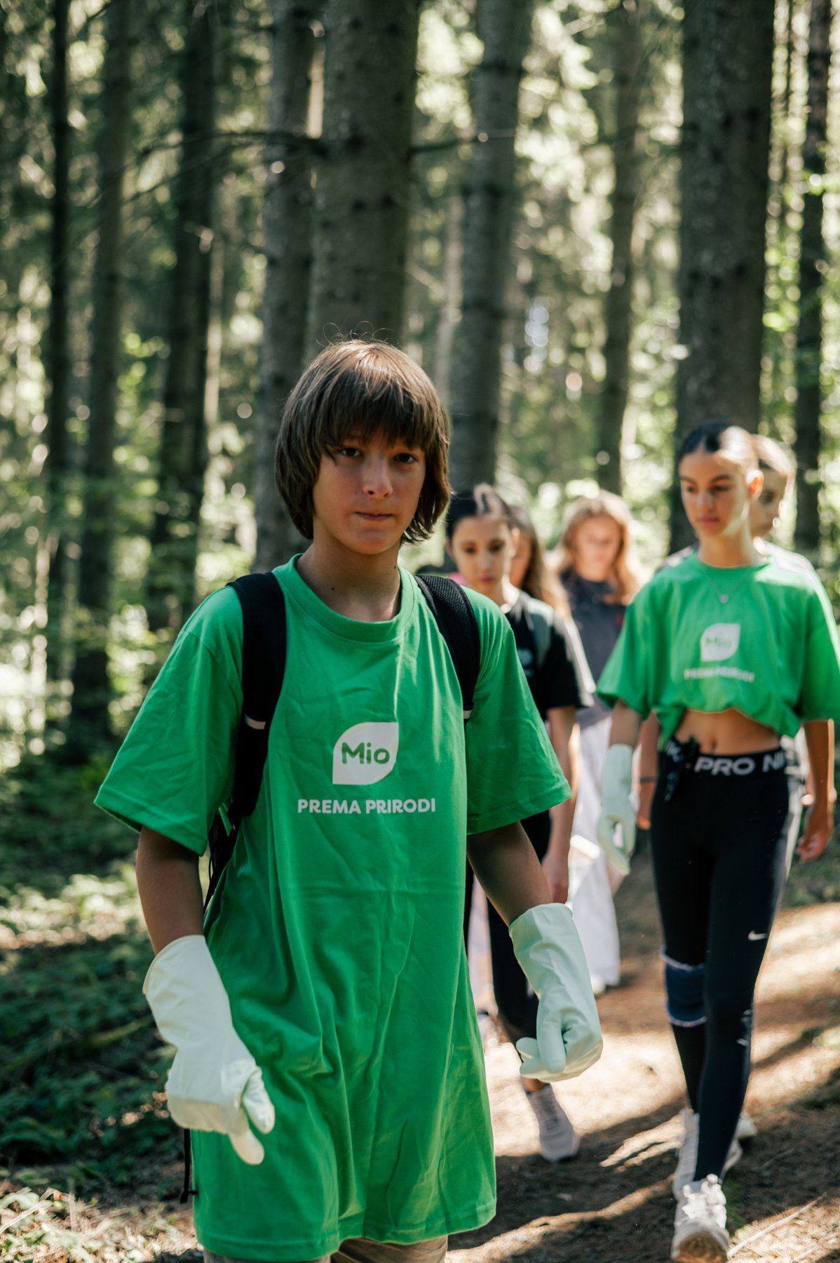 Boy in a green Mio T-shirt at the Javor cleanup action